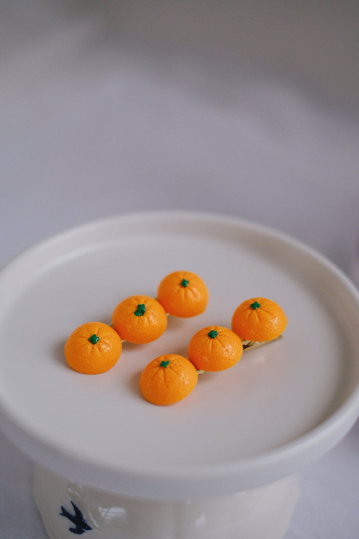 The vivid orange color adds a playful touch to any hairstyle, perfect for adding a fun flair to children's looks.