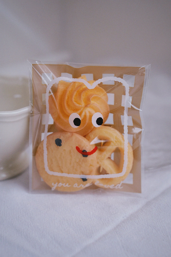 The 3 cookie hair clips come in a cute package with fun cartoon drawings, making it a great gift for children and adults alike.