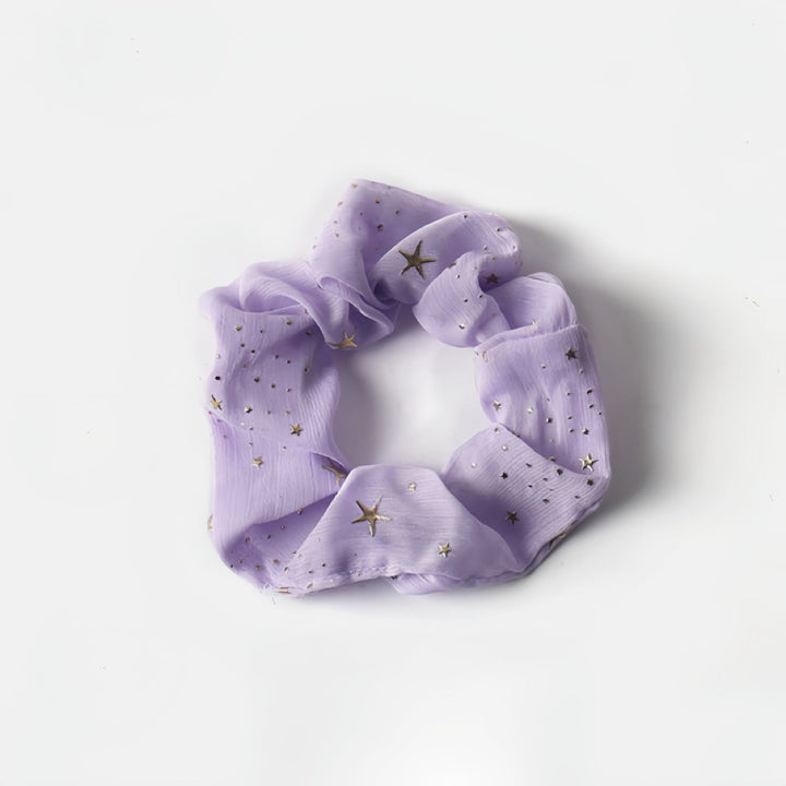 Our Light Purple Twinkle Stars Scrunchie is perfect for blondes, adding a magical touch to any hairstyle.