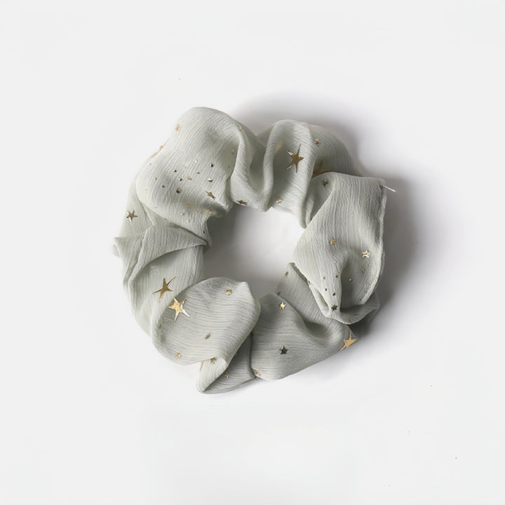 The subtle hues of this greyish green hair scrunchie is perfect for the classic Scandinavian styles.