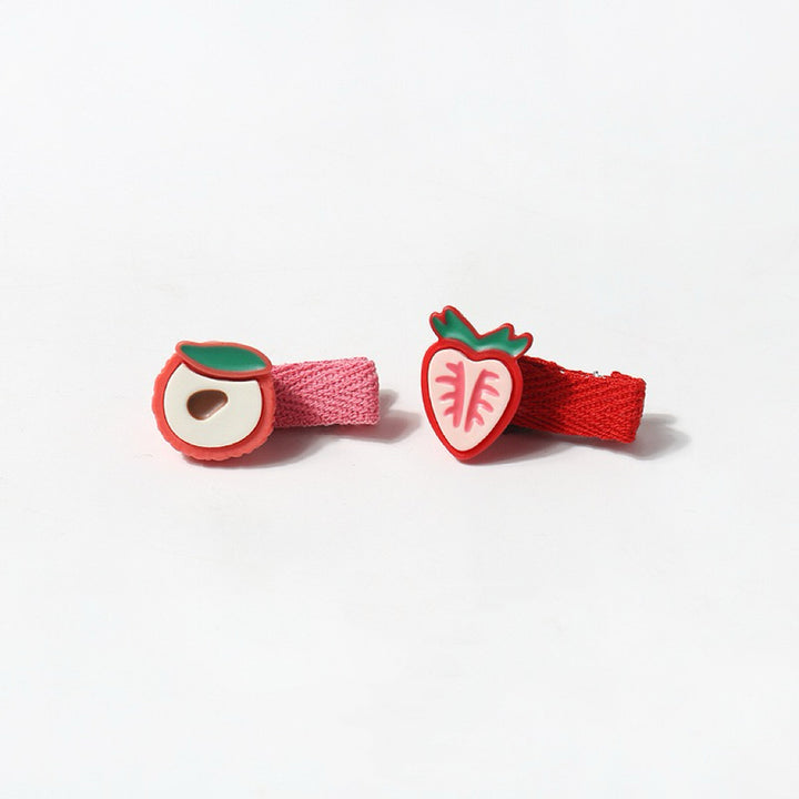 This image shows the strawberry and peach hair clips together, showcasing their red and pink design with intricate leaf details and matching red and pink fabric wrap.