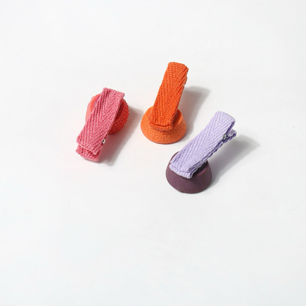 This image presents the back view of the hair clips, displaying the fabric-wrapped clips, ensuring a gentle hold on fine hair.