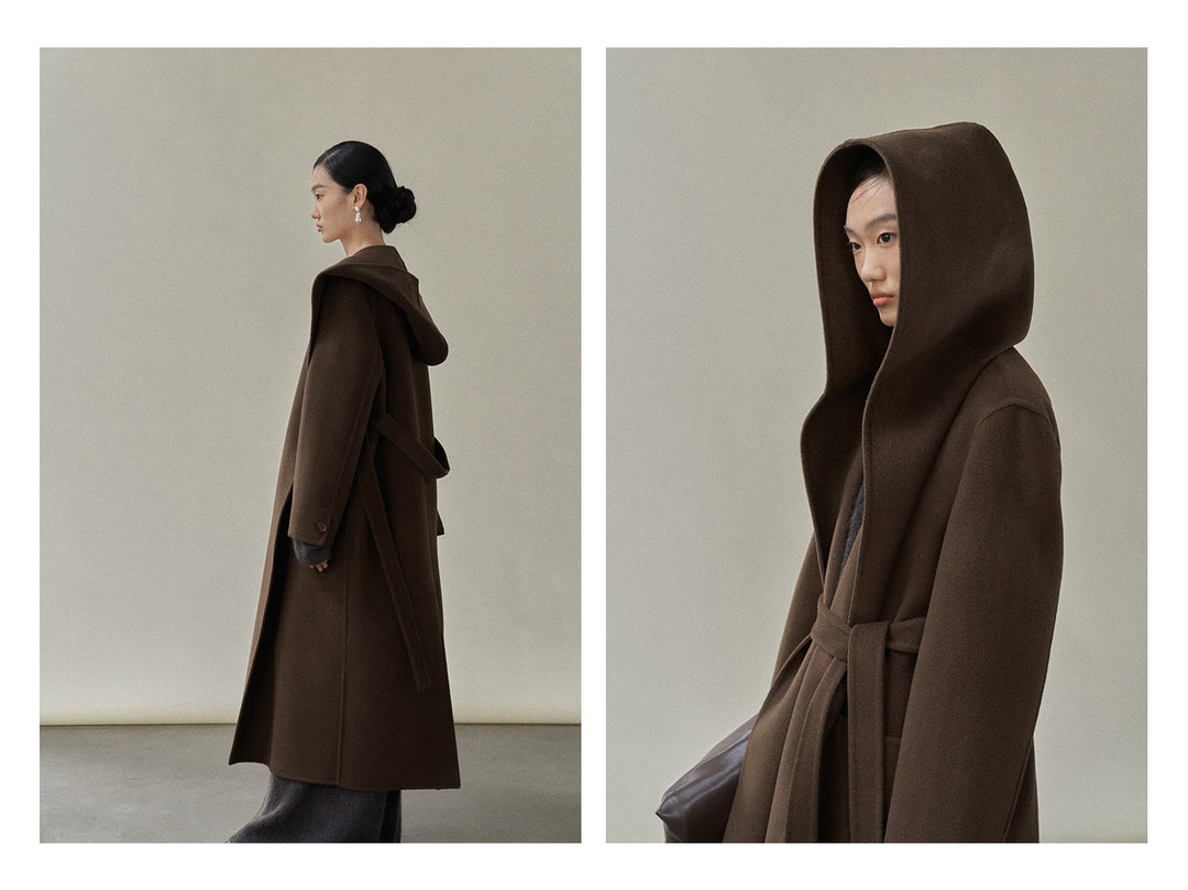Side profile of the chocolate coat, illustrating its elegant length and practical hood.