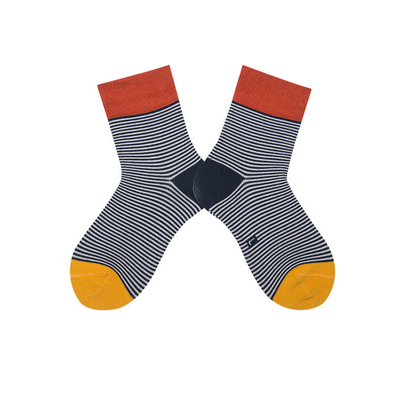 Boys' cotton socks in black with thin white stripes, embellished with red and yellow sections on the top and toe.