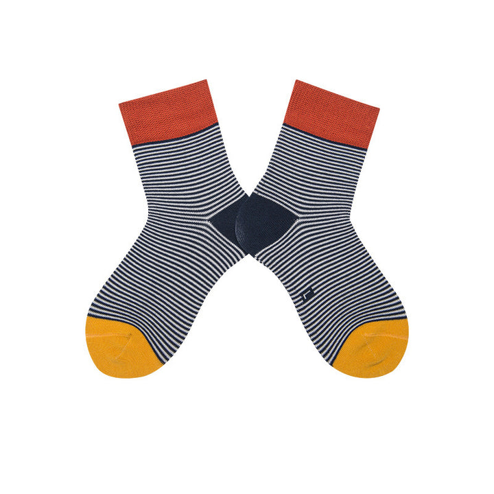 Boys' cotton socks in black with thin white stripes, embellished with red and yellow sections on the top and toe.