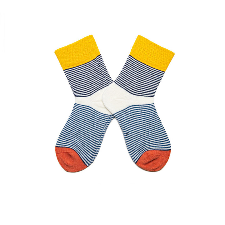 Children's cotton socks in white with thin navy blue stripes, accented with yellow and red sections.