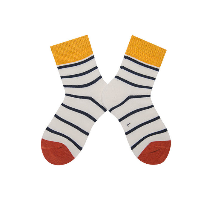 Children's cotton socks in white with black stripes, featuring yellow and red sections on the top and toe.
