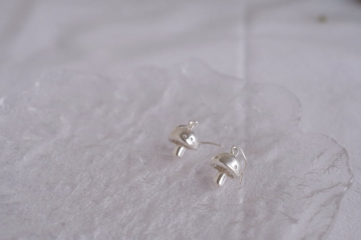 Side view of the sterling silver mushroom earrings, highlighting their intricate details and quality craftsmanship.