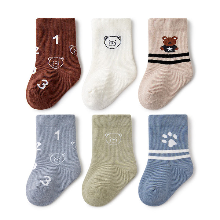 A charming collection of six pairs of baby socks featuring cute bear and paw designs, and playful number patterns in neutral colors, perfect for baby boys and baby girls.