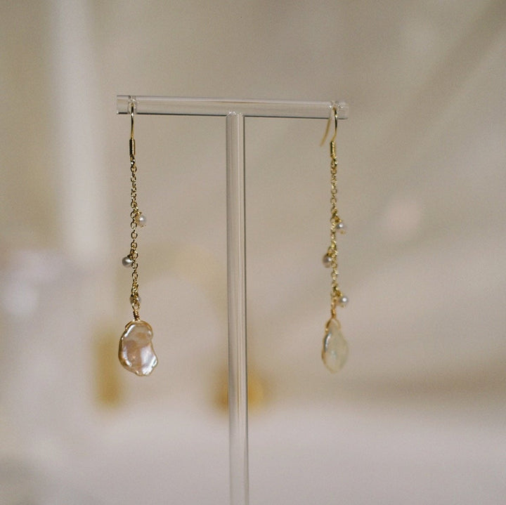 A detailed view of the 14k gold-plated sterling silver hook, showcasing the craftsmanship and the beautiful arrangement of the pearls.