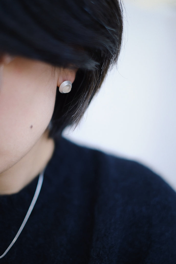 The Goddess Stud Earrings bring a sense of timeless elegance and balance, perfect for those who appreciate both the light and dark aspects of beauty. Their minimalist design ensures they are a versatile addition to any jewelry collection.