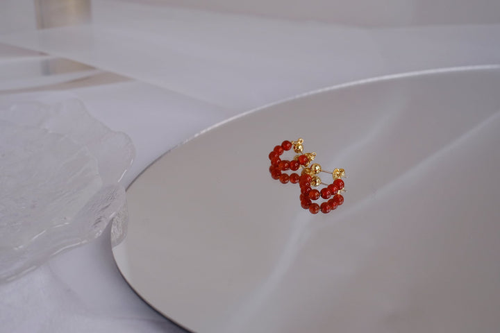 Side view of the 4mm earrings, highlighting the compact and chic design.