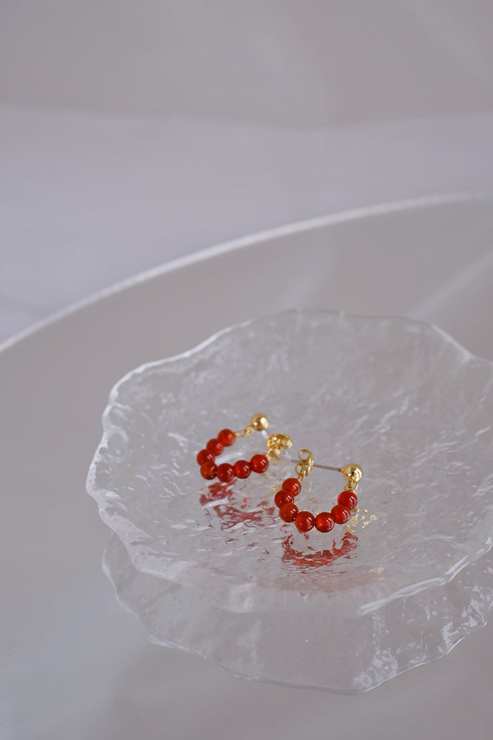 Detailed image of the 4mm onyx bead earrings, highlighting the delicate design and gold plating.