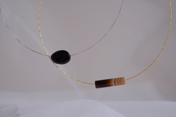 Both chokers displayed together on a white background.