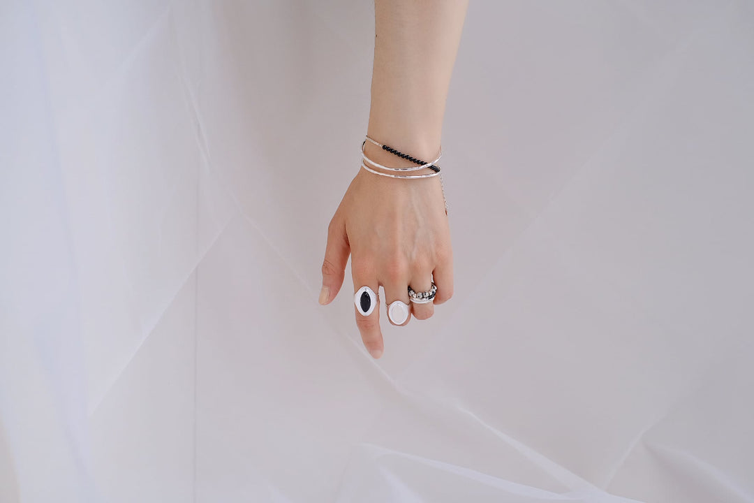 Embrace the art of layering and make a statement with this stunning piece that embodies the essence of modern elegance.