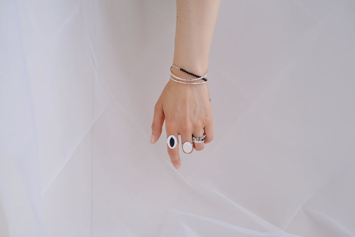 Embrace the art of layering and make a statement with this stunning piece that embodies the essence of modern elegance.