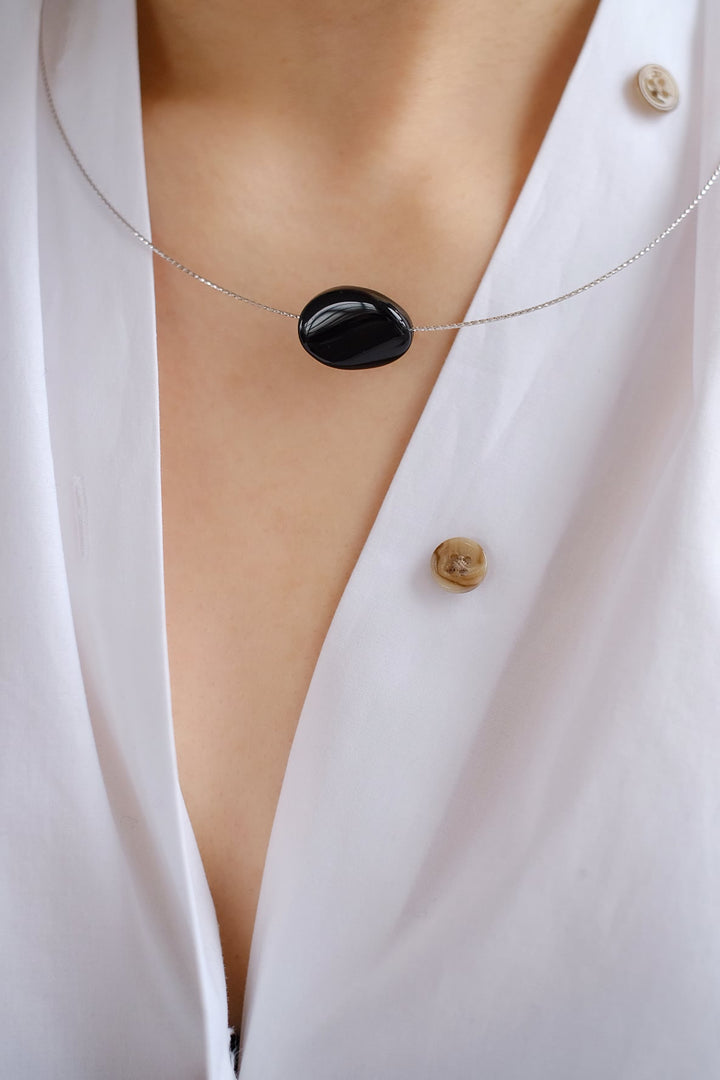 Liquorice Choker worn alone, highlighting the black onyx pendant.