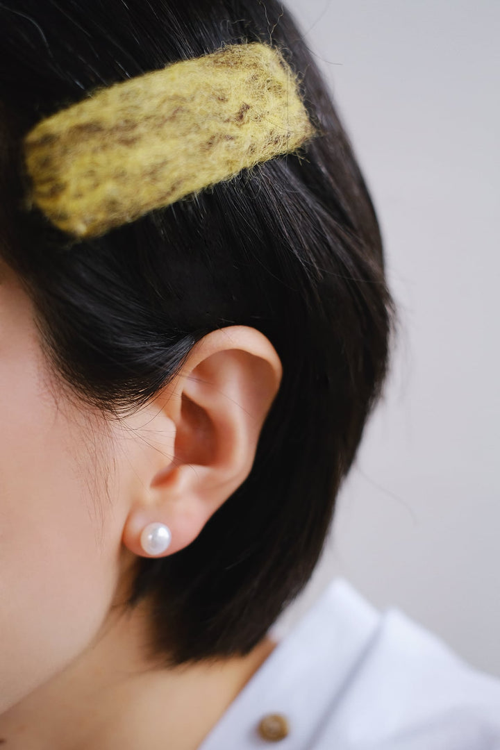 These pearl earrings are sure to become a staple in your jewelry collection.