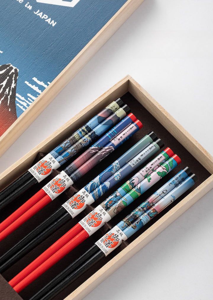 The gift box and chopsticks set placed together, showcasing their beautiful presentation and design.