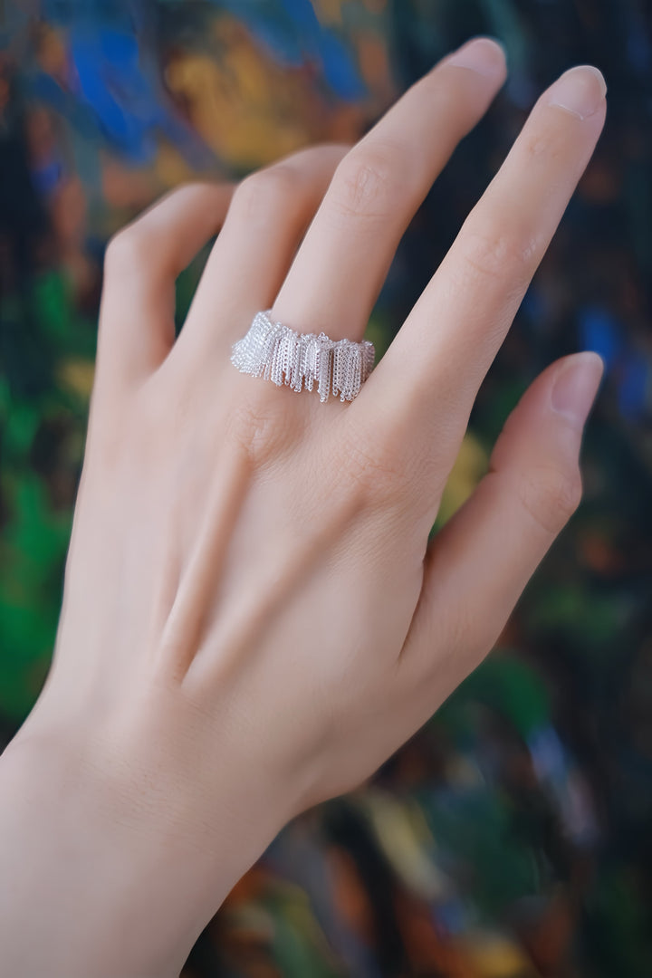 The shimmering tassels add a sense of elegance and sophistication, making this ring perfect for both everyday wear and festive gatherings.