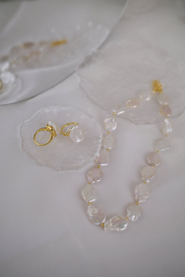 You can pair this necklace with our baroque pearl rings for a cohesive look.