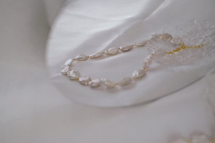 This pearl necklace boasts elegance and charm.
