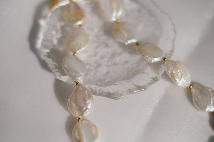 A close-up image showcasing the exquisite luster of the baroque coin pearls featured in our necklace.
