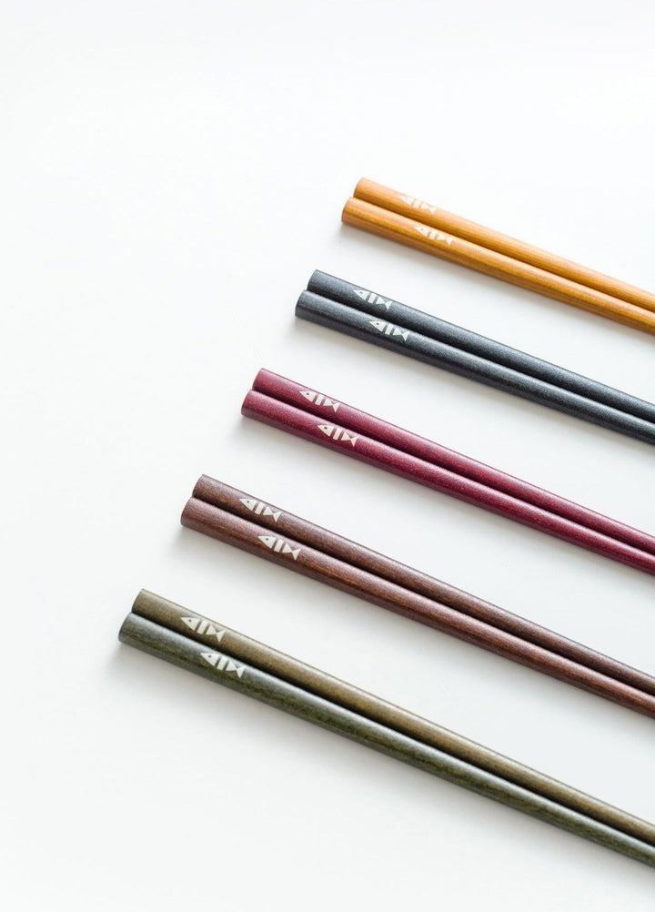 A top-down view of the chopsticks, highlighting their varied colors and smooth finish.