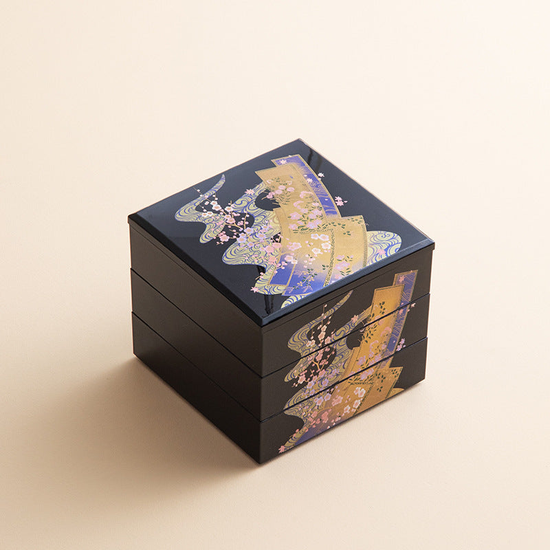The Sensu & Waves design features gold leaf patterns of traditional Japanese folding fans and swirling waves, symbolizing elegance, strength, and fluidity.