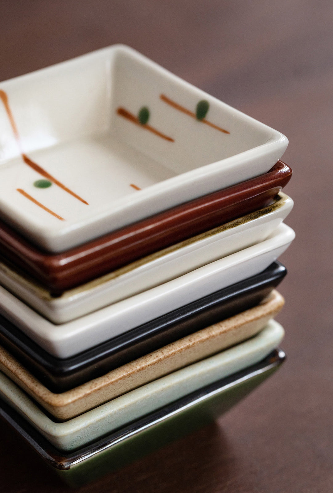 The plates stacked neatly together, demonstrating their uniform size and how they fit perfectly for compact storage.