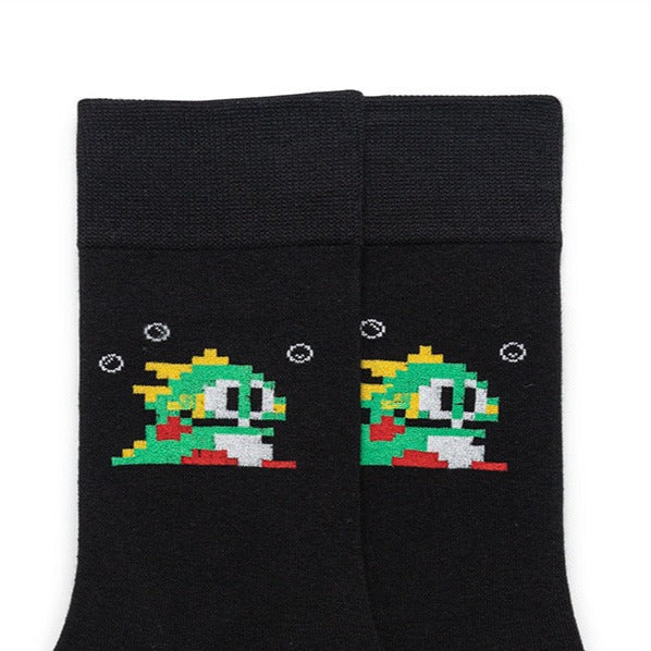 Close-up of the video game-inspired dinosaur motif on a black sock, highlighting the colorful and detailed design.