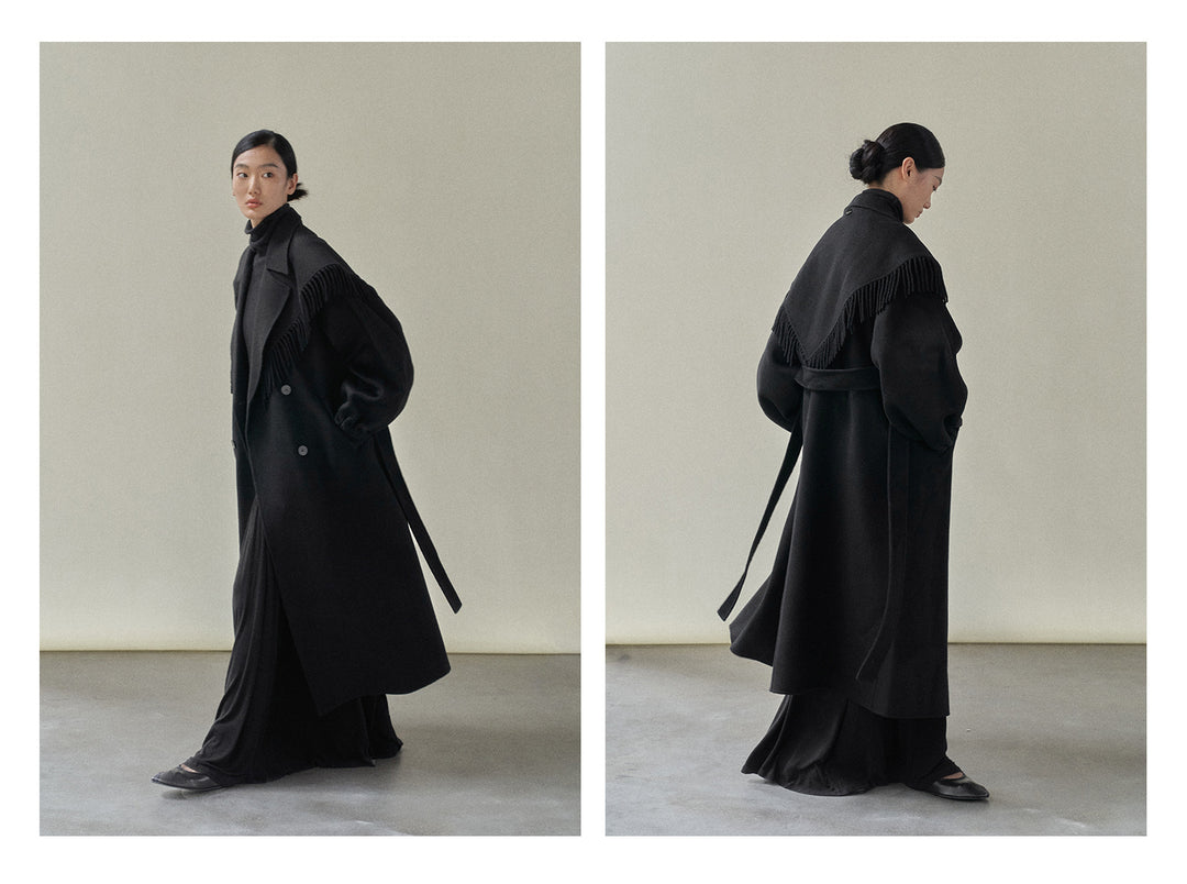 Experience the perfect blend of practicality and high fashion with this wool coat with removable fringe scarf.