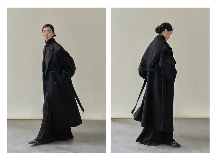 Experience the perfect blend of practicality and high fashion with this wool coat with removable fringe scarf.